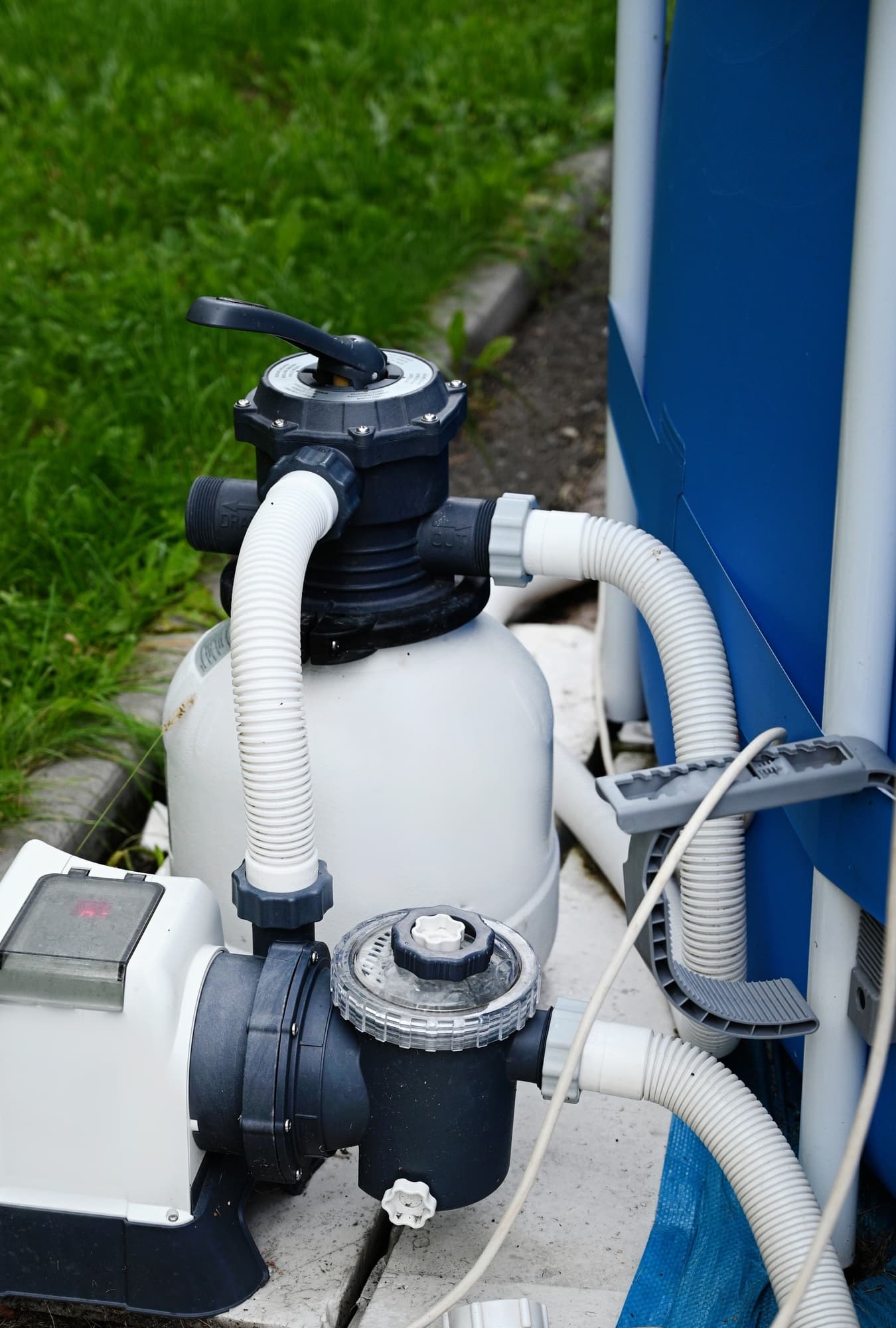Sand filter system next to a pool in your own garden