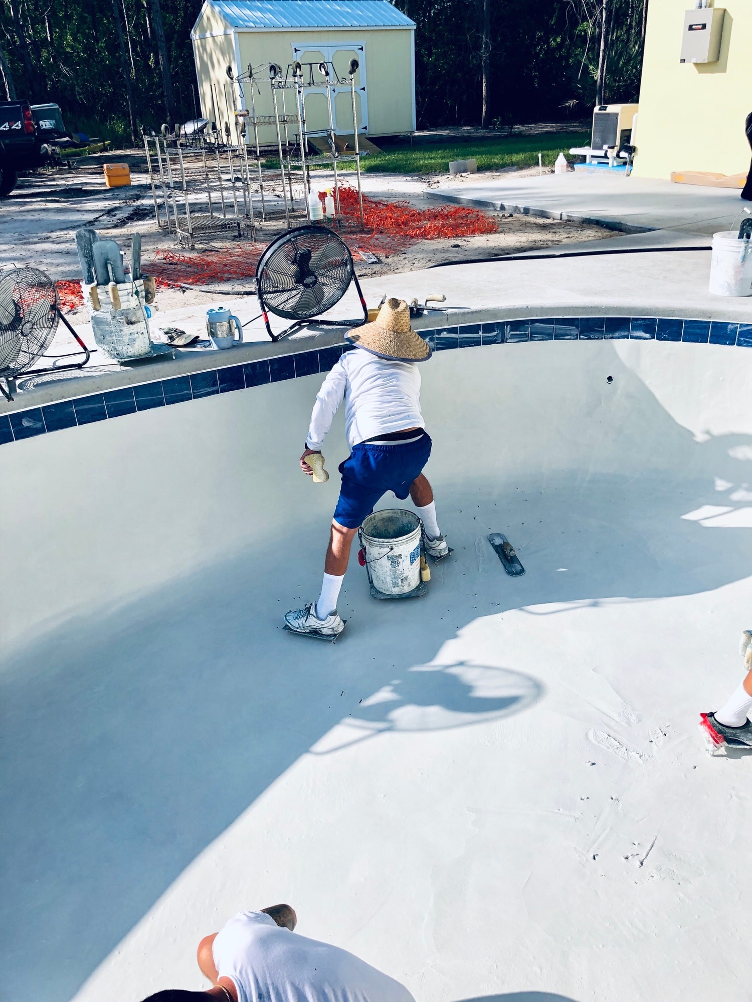 Worker putting the finishing touches to the pool.